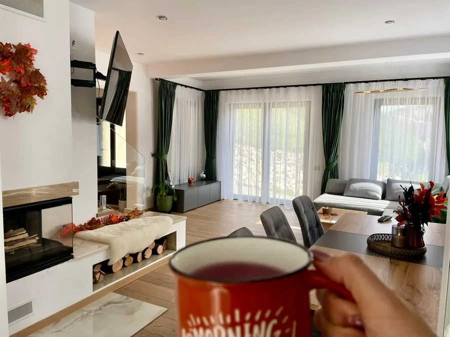 Autumn living room with morning coffee and the fireplace in the background